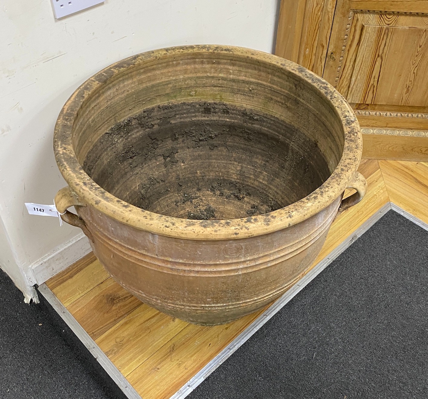 A large circular Grecian style earthenware garden urn, diameter 75cm, height 66cm